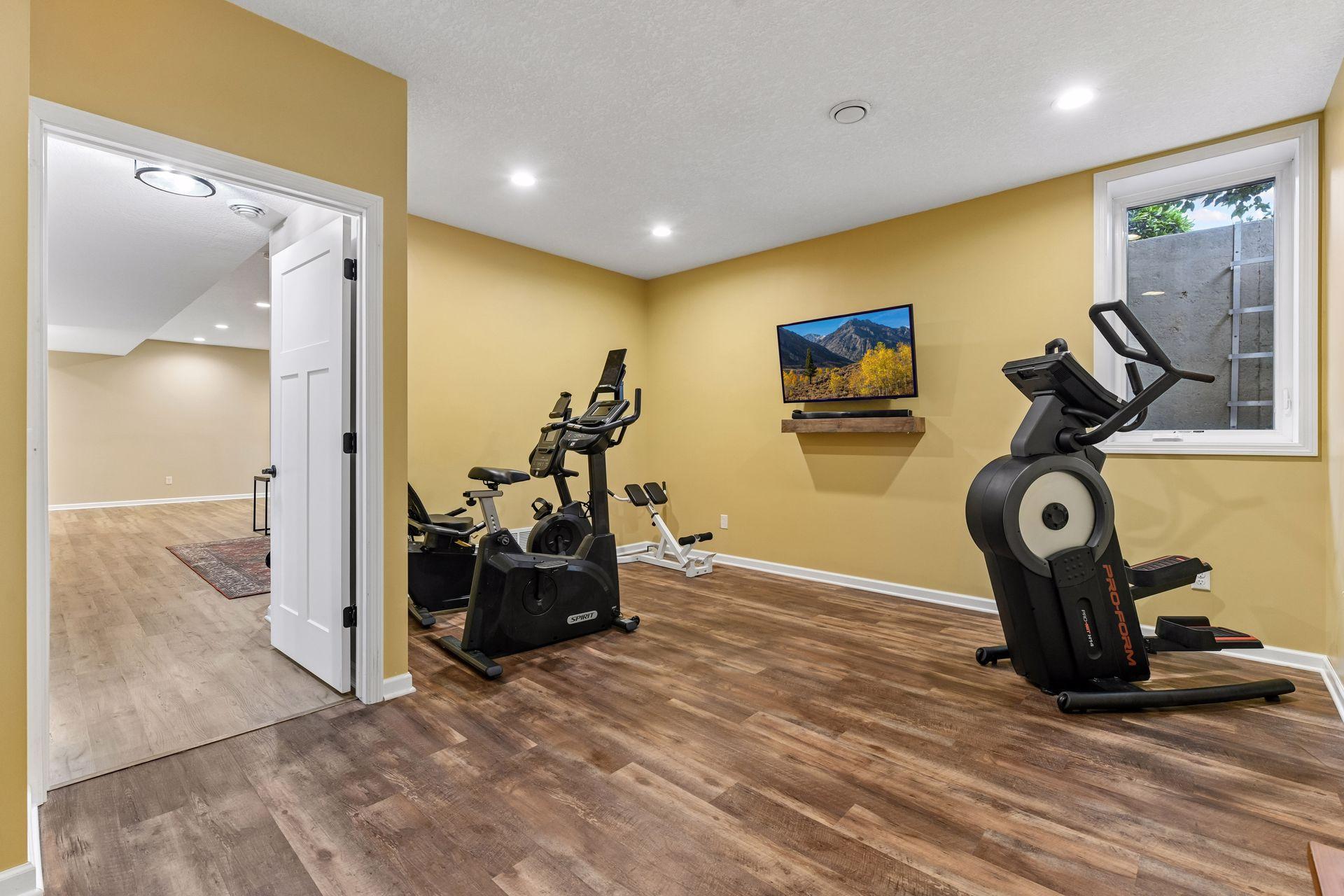 Versatile lower-level room offers endless possibilities as a home gym, fifth bedroom, hobby room, or private guest space. Bright and spacious with updated flooring, this flexible area adapts easily to your lifestyle and needs.