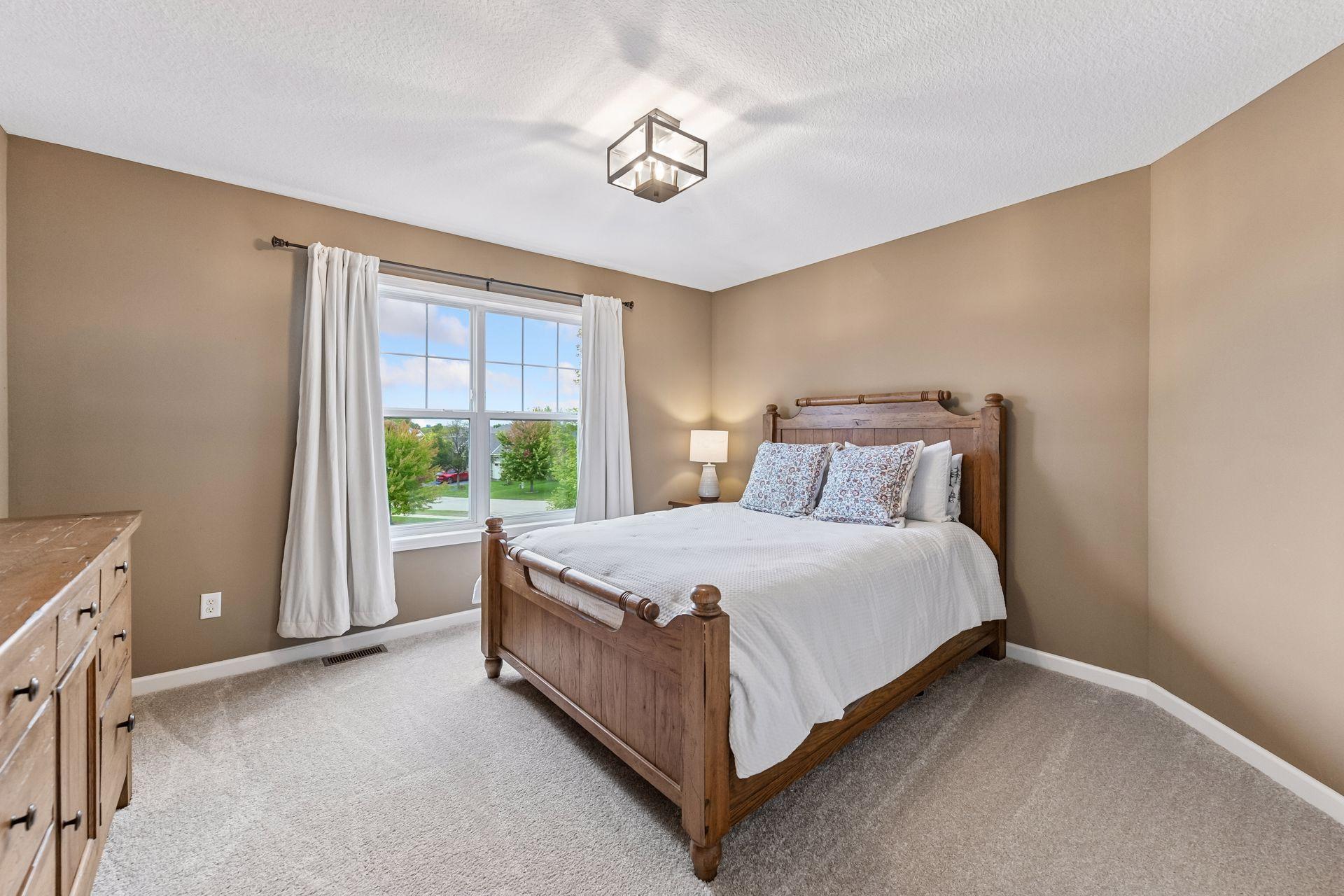 One of four upper-level bedrooms, this spacious retreat offers generous closet space, abundant natural light, and versatile room for family, guests, or a home office. Thoughtfully designed with comfort and functionality in mind.