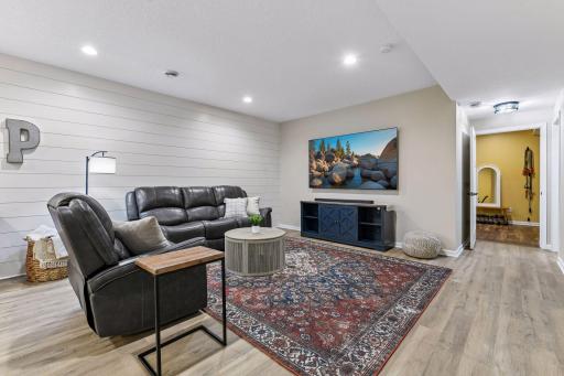Enjoy a second family room in the finished lower level, offering the perfect space for movie nights, game days, or relaxing with friends and family. Spacious and versatile, this bonus living area provides room for everyone to spread out and unwind.
