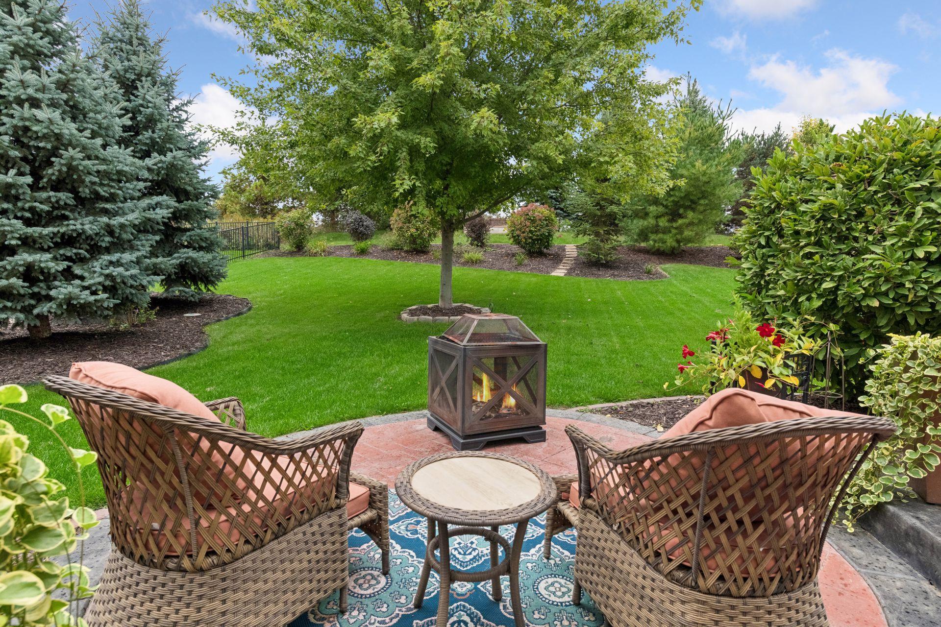 Picture yourself unwinding in this private backyard oasis, surrounded by mature trees, lush landscaping, and scenic green space views. Whether enjoying morning coffee or evening fireside conversations, this peaceful retreat is designed for outdoors.