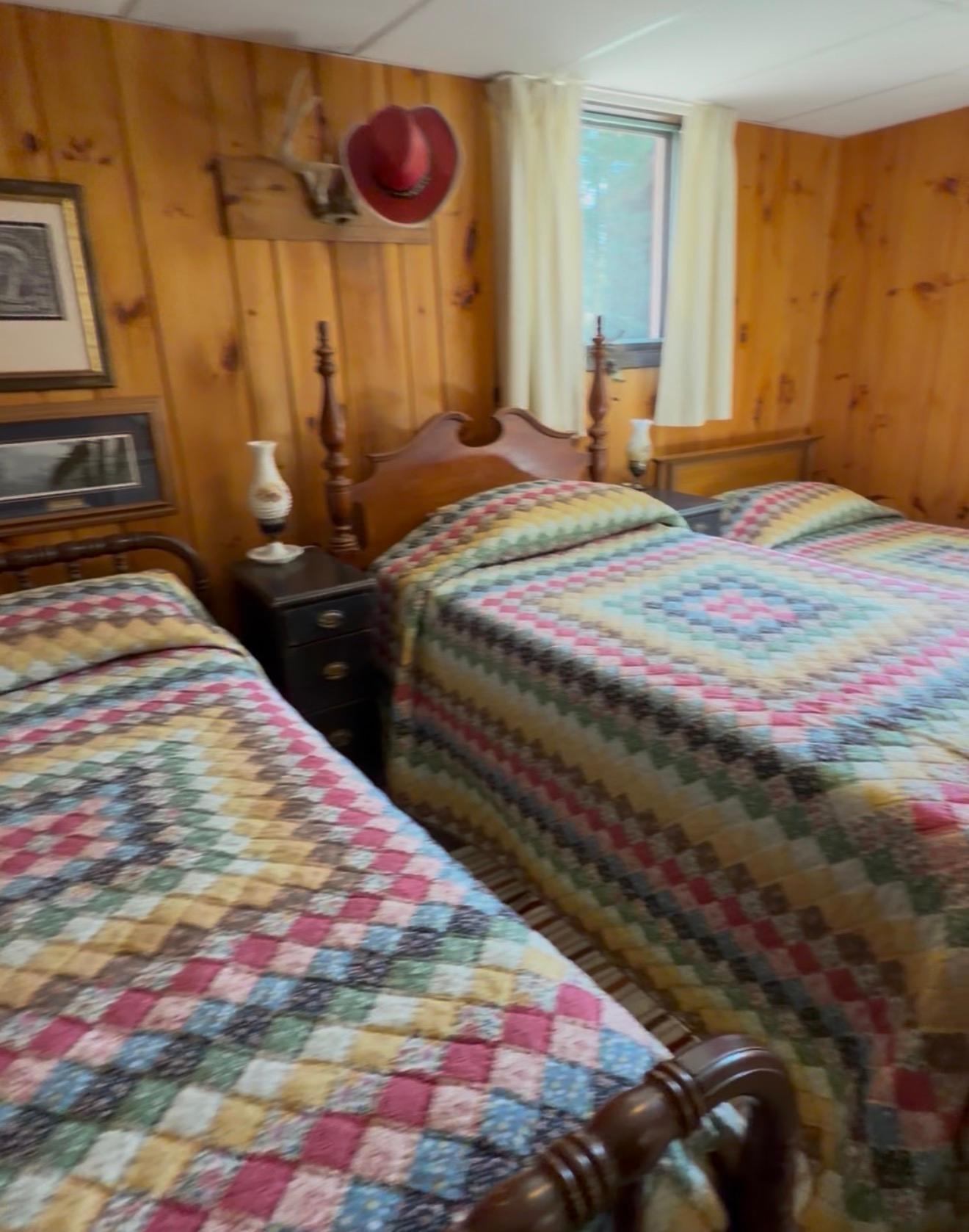 Third bedroom in the lower level. It fits 3 beds and a dresser.