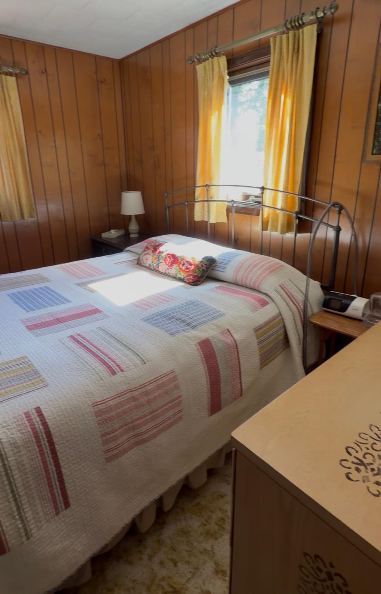 Primary bedroom with room for a queen-sized bed, night stands and a couple of dressers.