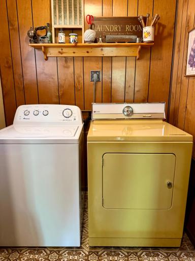 Main level laundry and utility room with extra storage.