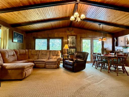 The vaulted ceilings are gorgeous and show off in this spacious living area!