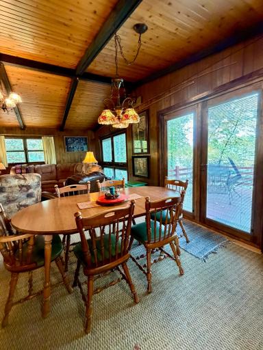 Dining area that leads out onto the deck with river views.
