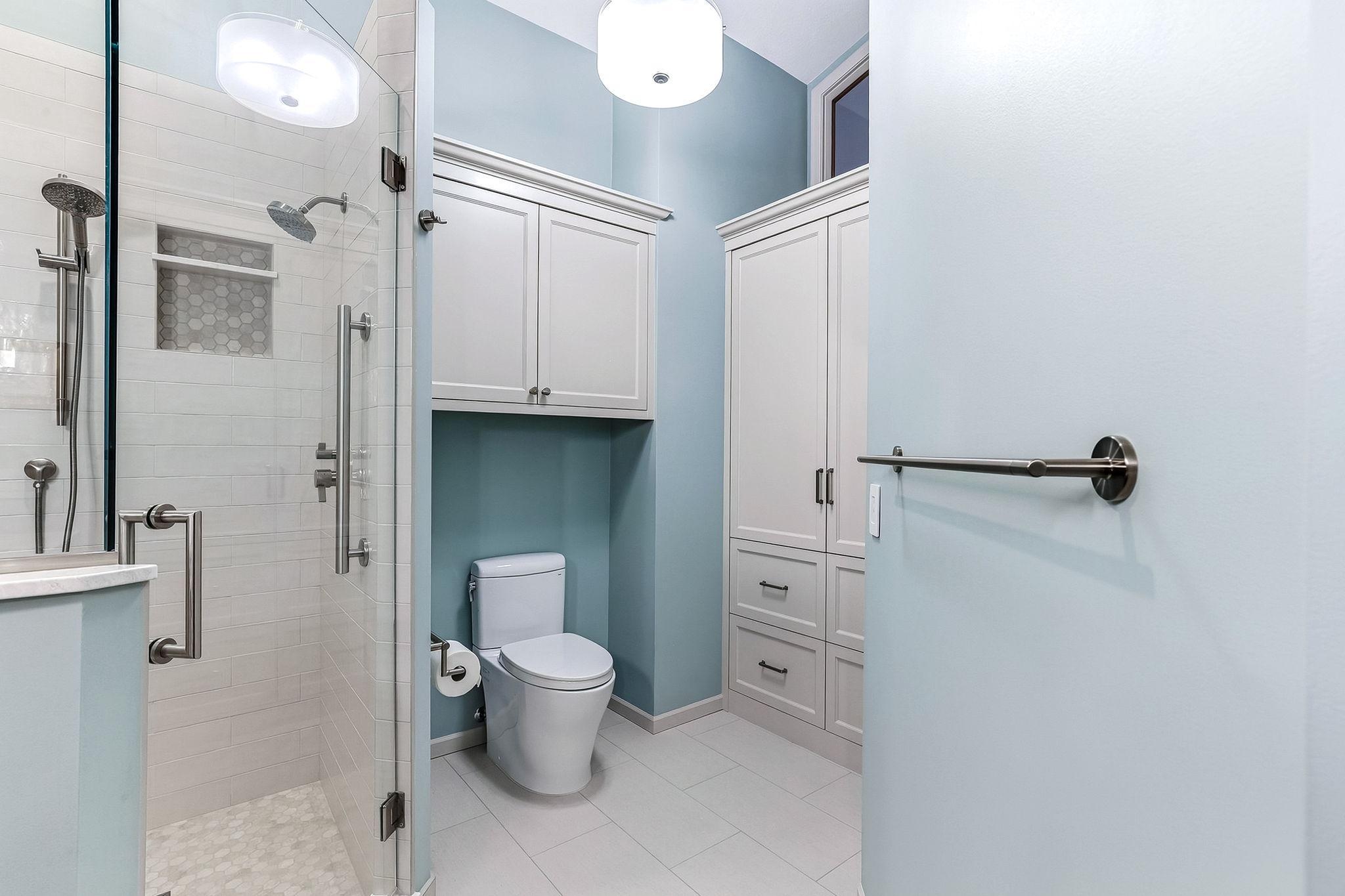 Upscale finishes include custom cabinetry and tile work
