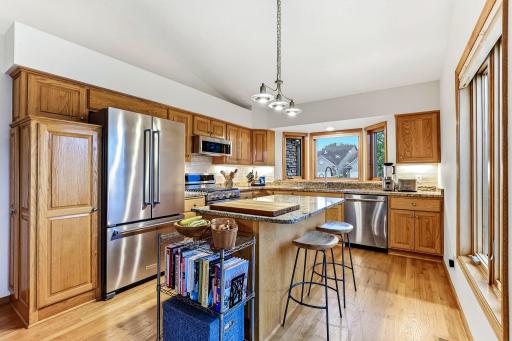 Kitchen features granite countertops and stainless steel appliances