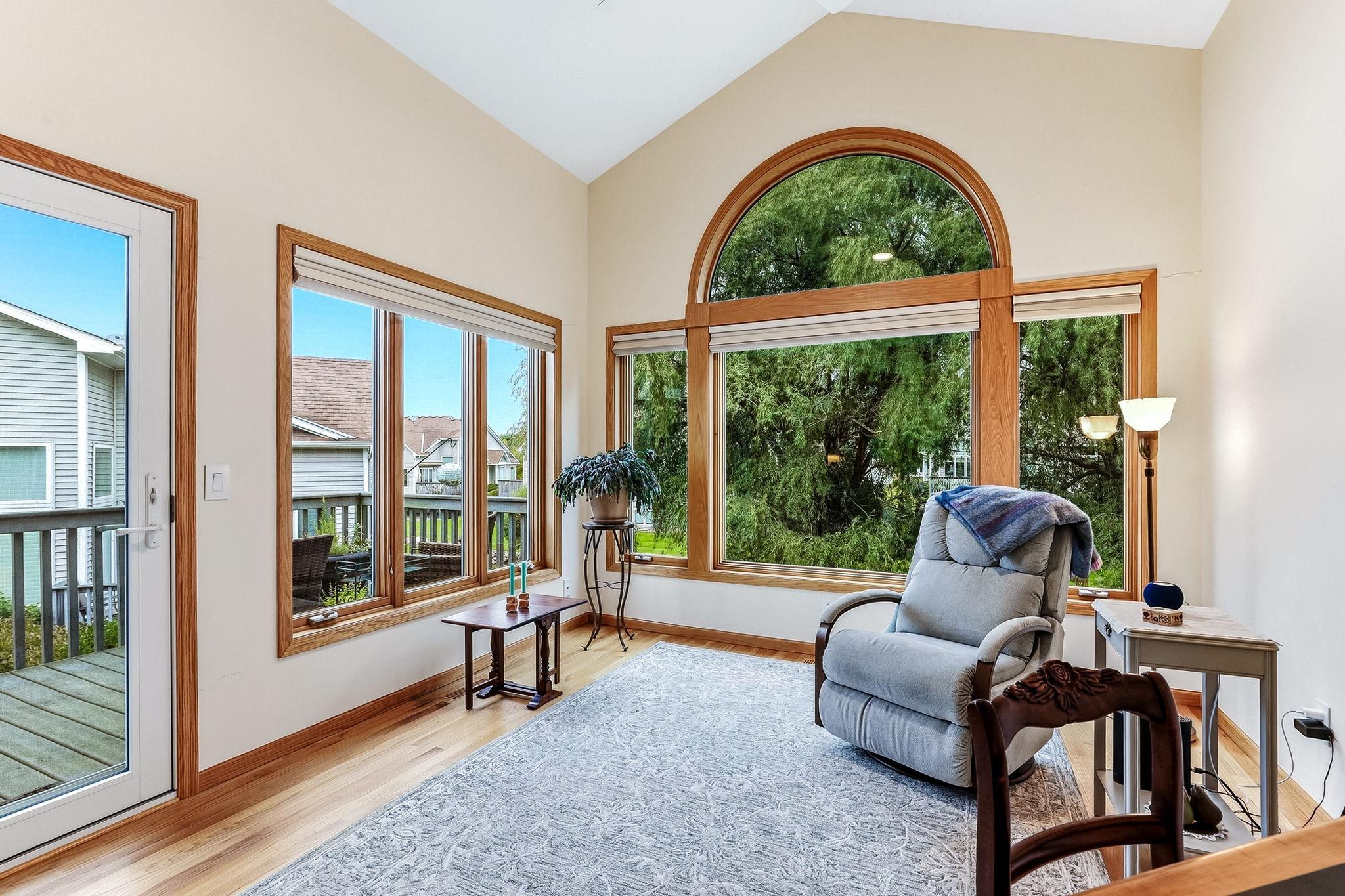 Sunroom off the living room offers deck access