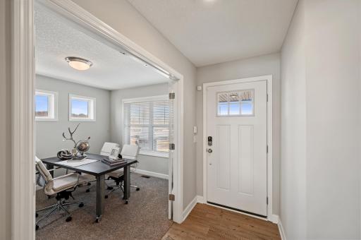 (Photo of model home, actual features may vary) Situated on the main level at the front of the home, the flex room has a variety of possible uses such as a home office, as itâs configured here.