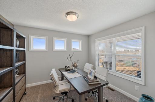 (Photo of model home, actual features may vary) Situated on the main level at the front of the home, the flex room has a variety of possible uses such as a home office, as itâs configured here.