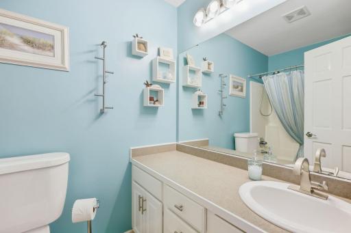 Upstairs full bathroom with updated hardware and lots of counter space and storage.