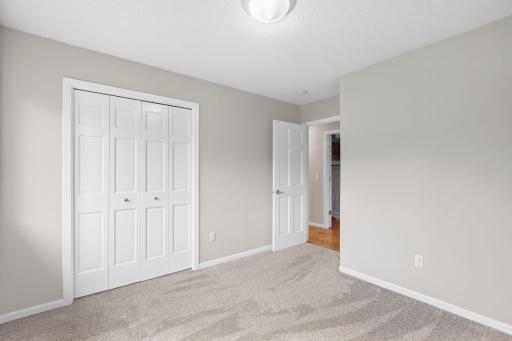 Upstairs bedroom, recently painted with newer carpet.