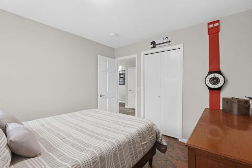 Lower level guest 4th bedroom off of family room with neighboring 3/4 bathroom.