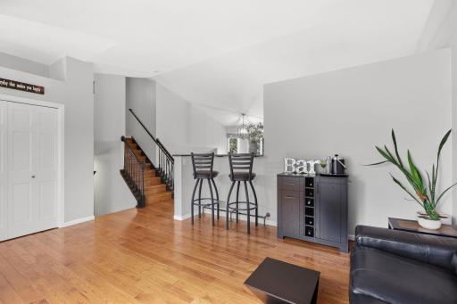 View of vaulted entryway area and staircase leading up to 3 bedrooms on same level & 2 baths.