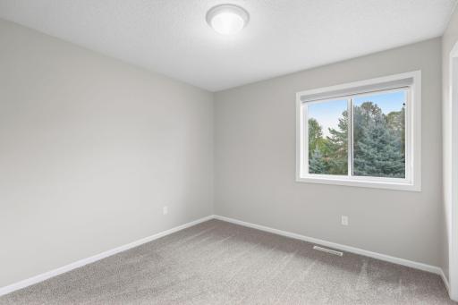 Upstairs bedroom, recently painted with newer carpet.