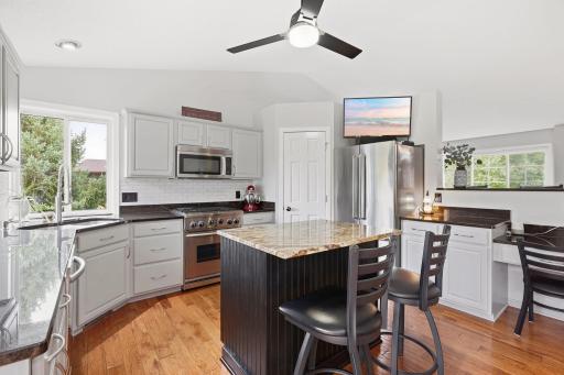 Completely updated kitchen, corner kitchen window with granite solid surface counters, lots of storage, stainless steel appliances, walk in pantry with upgraded storage rack & spice organizer.
