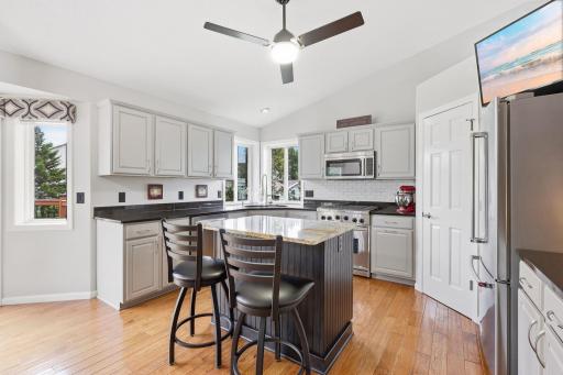 Completely updated kitchen with granite solid surface counters, lots of storage, stainless steel appliances, walk in pantry with upgraded storage rack & spice organizer.