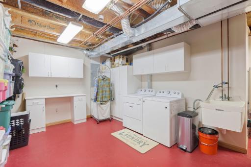 Laundry, mechanical room with laundry tub.