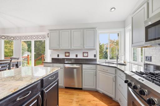 Completely updated kitchen, corner kitchen window with granite solid surface counters, lots of storage, stainless steel appliances, walk in pantry with upgraded storage rack & spice organizer.
