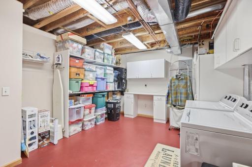 Laundry, mechanical room with laundry tub, LOTS of storage space
