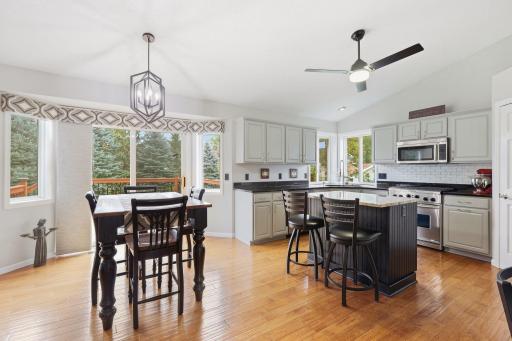 Open concept, spacious completely updated eat in kitchen with granite counters & stainless steel appliances, subway tile back splash, updated lighting with ceiling fan. Sun filled & bright...