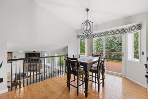 Eat in kitchen, dining area with beautiful view of backyard and glance down to lower level family room