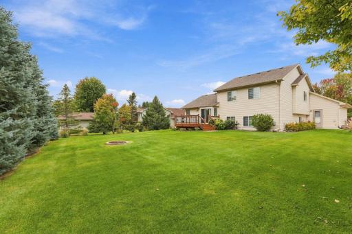 Amazingly private backyard surrounded by mature pine trees, entertain & relax with backyard fire pit.
