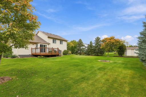 Amazingly private backyard surrounded by mature pine trees, entertain & relax with backyard fire pit.