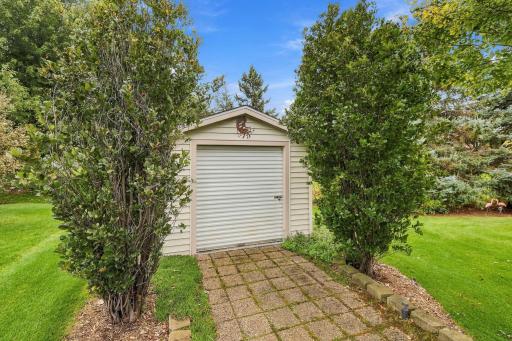 Spacious storage shed with roll front door.