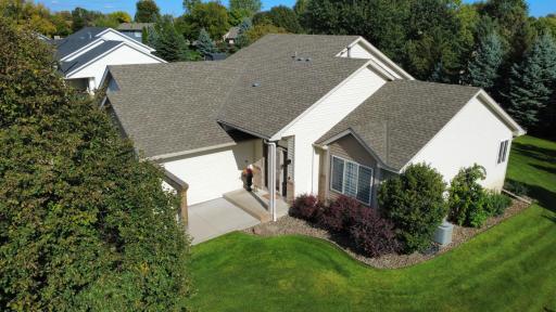 Aerial photo of front of home, professionally landscaped.