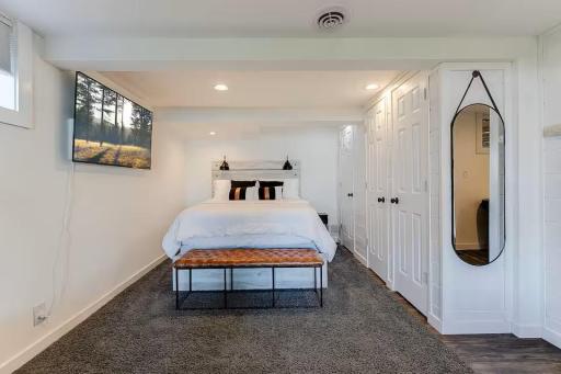 Another comfortable bedroom with a warm, inviting feel.