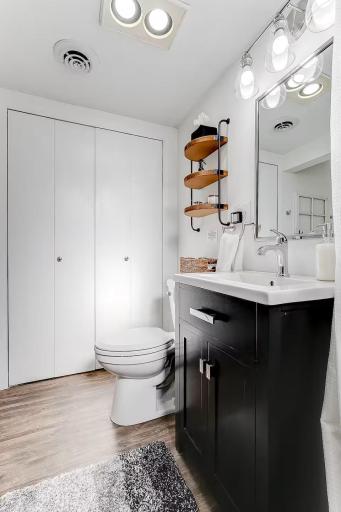 Convenient lower-level bath offers additional functionality for guests.