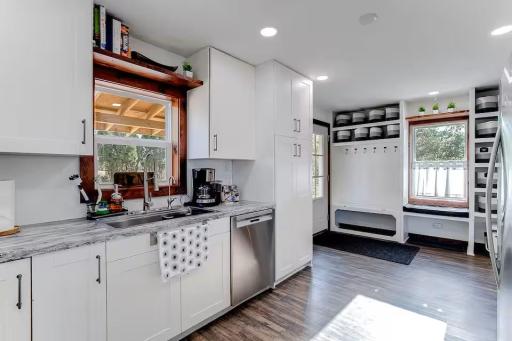 Kitchen opens conveniently to the entry and main living areas for everyday functionality.
