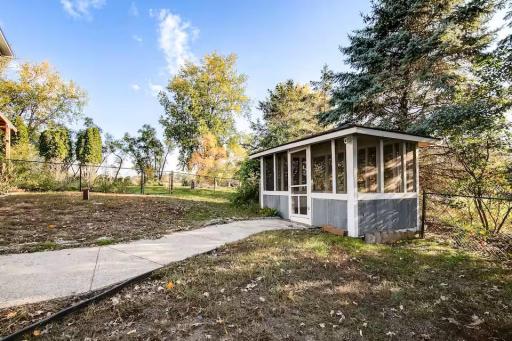Screened gazebo with electricity provides a relaxing outdoor escape near the water.