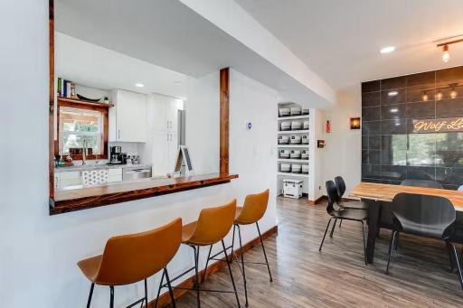 Casual counter seating connects the kitchen to the home's open gathering spaces.