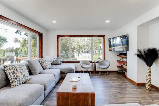 A wall of windows keeps Wolf Lake front and center from the living room.