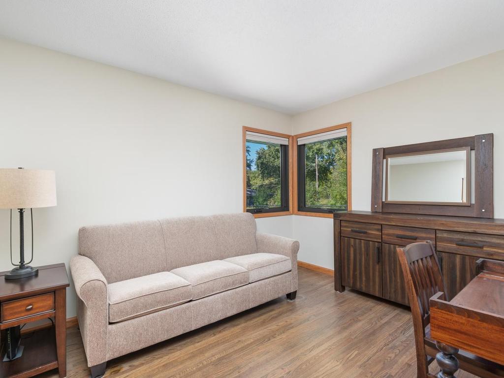 A second main-level room offers space for a bedroom, office, or sitting area.