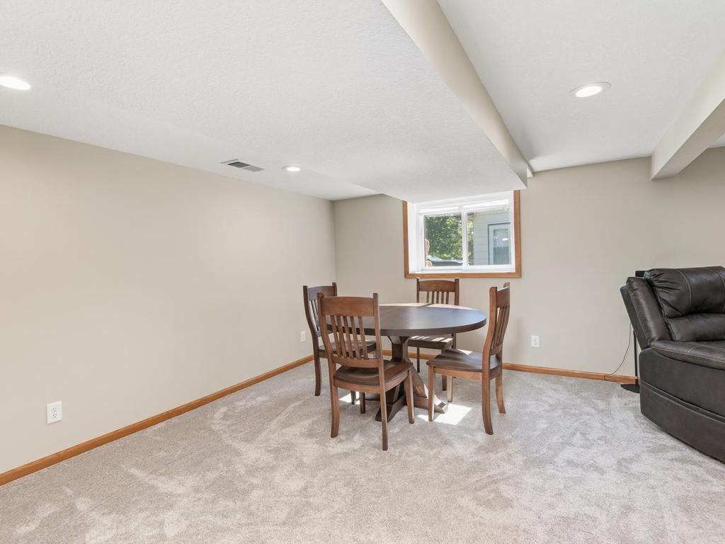 An additional area on the lower level offers room for a game table or other activities.