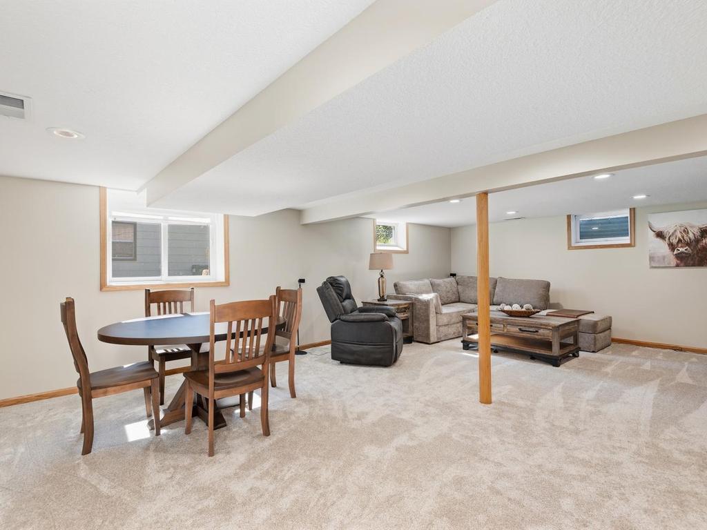 A wider view shows how much space the finished lower level provides for relaxing and entertaining.
