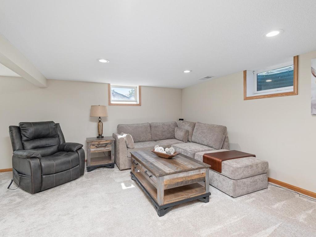 The lower-level amusement room has space for a large seating area and movie nights.