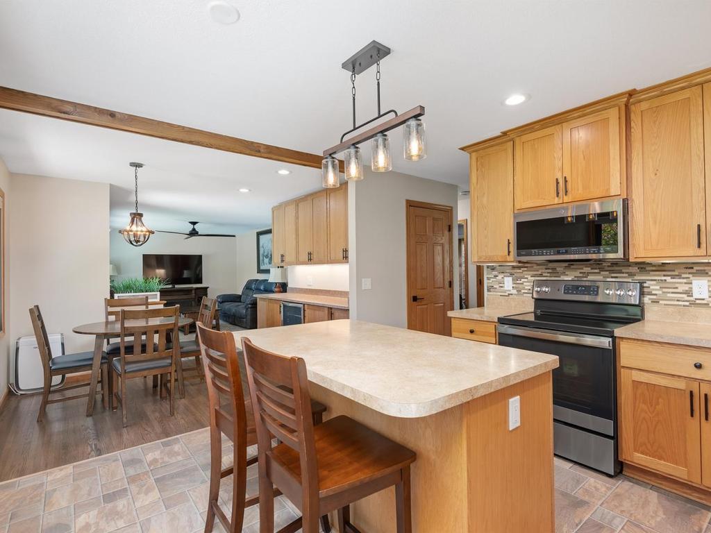 The kitchen opens to the dining and living areas, keeping the main level connected.