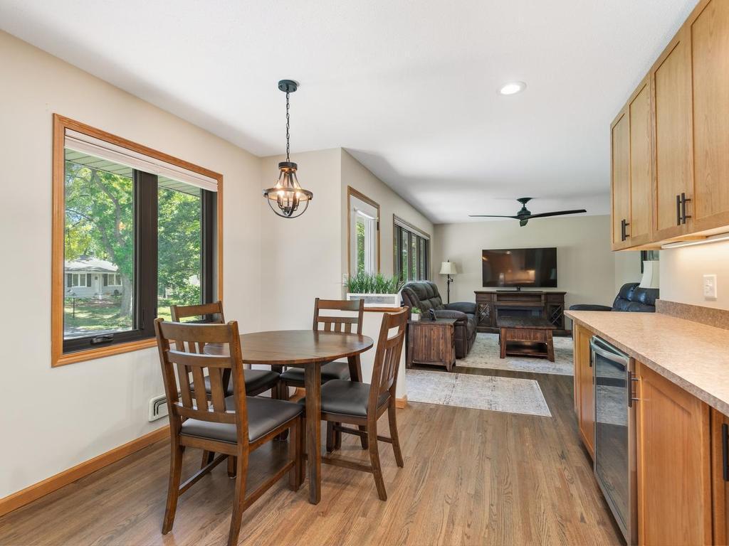 An open view from the kitchen through the dining area to the living room.