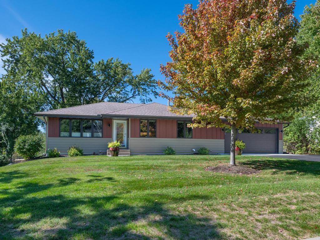 Mature trees and a spacious front lawn add to the home’s curb appeal.