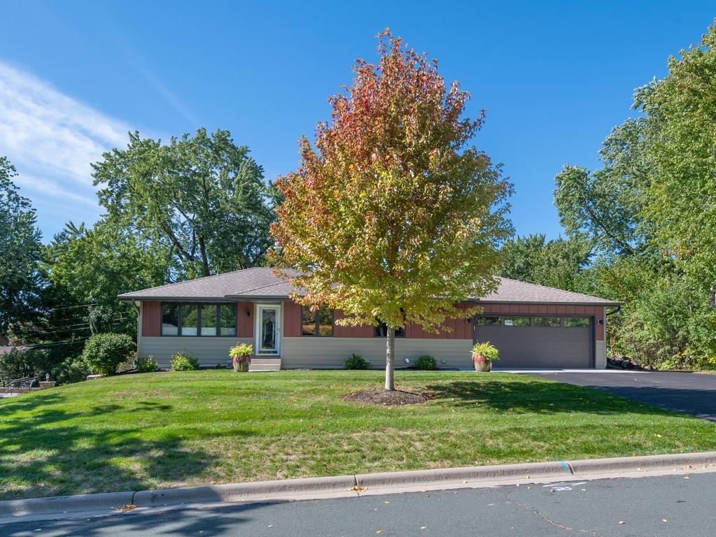 Set back from the street on a generously sized lot in a Burnsville neighborhood.