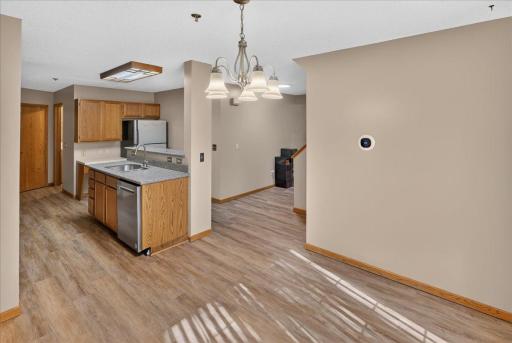 Bright, open main level featuring new flooring, fresh paint and a smart Wi-Fi thermostat.