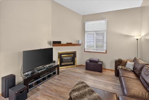 Bright living room with soaring ceiling and plenty of space to relax and entertain.