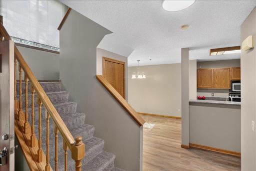 Welcoming main level with new flooring, fresh paint and an easy flow between the living, dining and kitchen areas.