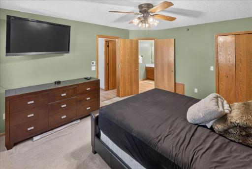 Another view of the spacious primary bedroom with easy access to the upper-level bath.