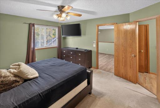 Primary bedroom offers plenty of room for a king-size bed and additional furniture.