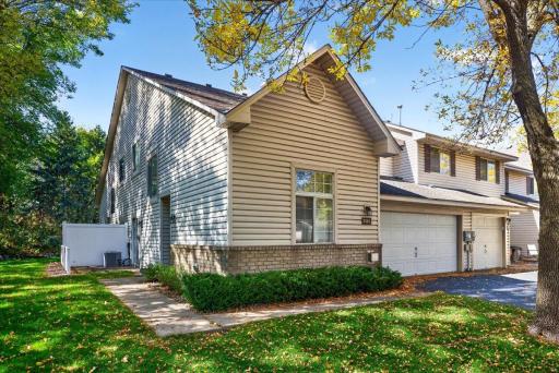 Desirable end-unit townhome tucked into a quiet, wooded setting in Mendota Heights.